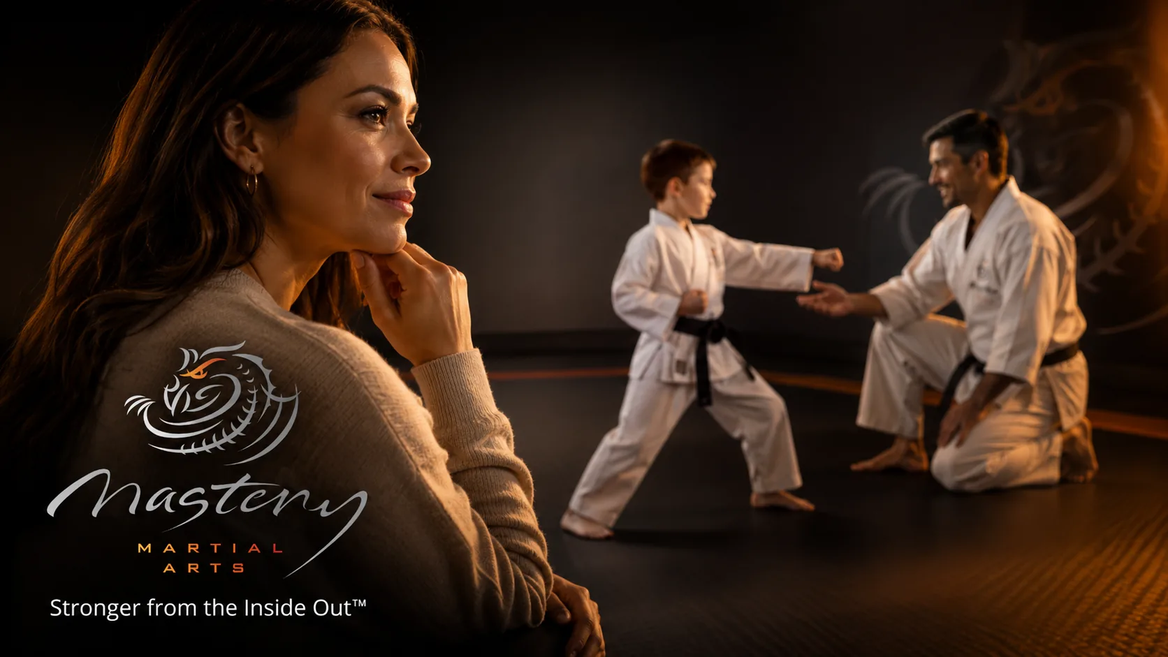 Parent proudly watching their child practice martial arts with a supportive instructor at Mastery Martial Arts.